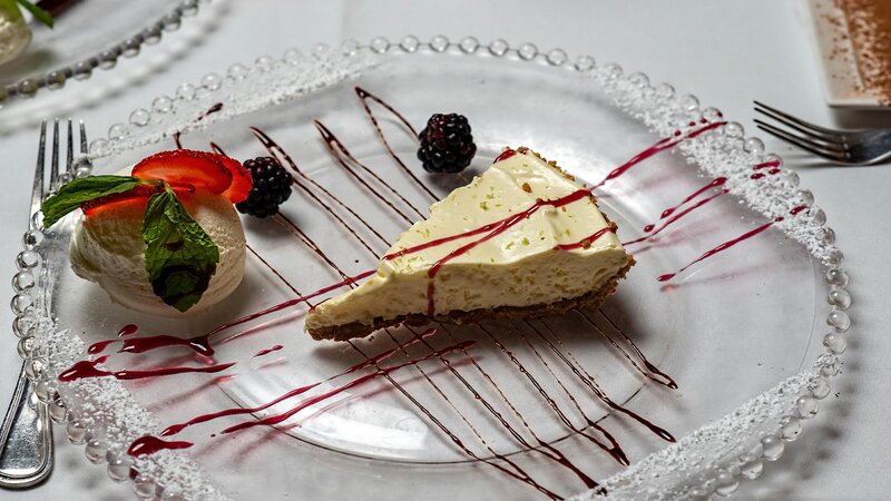 NY Cheesecake with fresh fruit and strawberry sauce